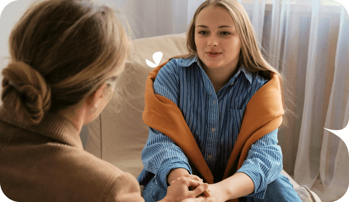 A therapist and her client are face to face, in a therapy session. The therapist is utilizing a technique found in this list of therapeutic interventions.