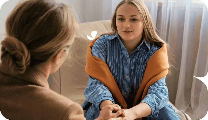 A therapist and her client are face to face, in a therapy session. The therapist is utilizing a technique found in this list of therapeutic interventions.