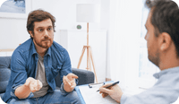 Two male therapists discuss therapist and clinical psychologist abbreviations