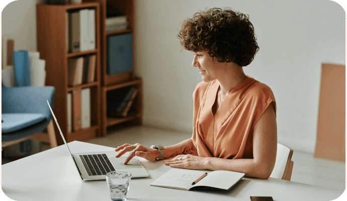 A female therapist looks at the top 10 therapist websites on her laptop computer