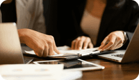 A therapist holds insurance claims and wonders how to prevent mental health insurance claim denials