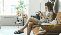 A female therapist sits in her office wondering why therapists need a no-show and cancellation policy