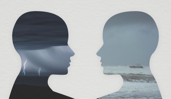 Silhouettes of two people are facing each other. Both are filled in with cloudy grey patterns.