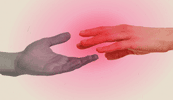 Two hands reach for each other as if to shake, illuminated by pinkish light.
