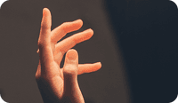 A hand of someone experiencing somatic therapy