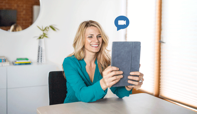 Person smiling, using Telehealth by SimplePractice.