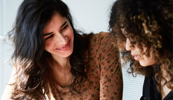 2 woman socializing about mental health