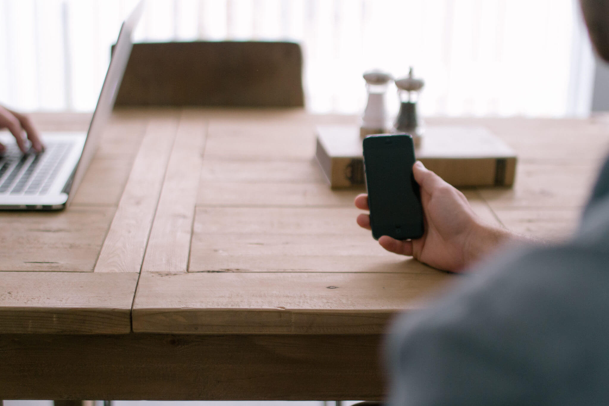 blog photo of person using iphone to represent security risks