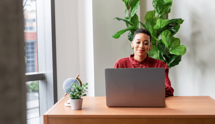 Female therapist looks up ICD and CPT codes on her laptop for insurance billing