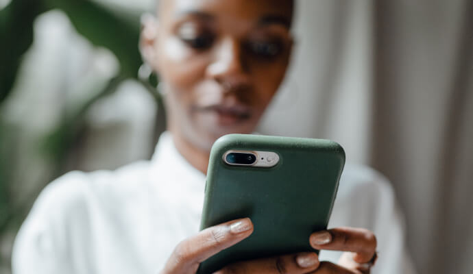 woman using phone to schedule mental health appointment