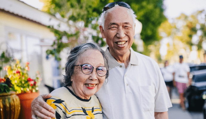 A picture of an elderly couple smiling. Read this article for more on how aging affects mental health.