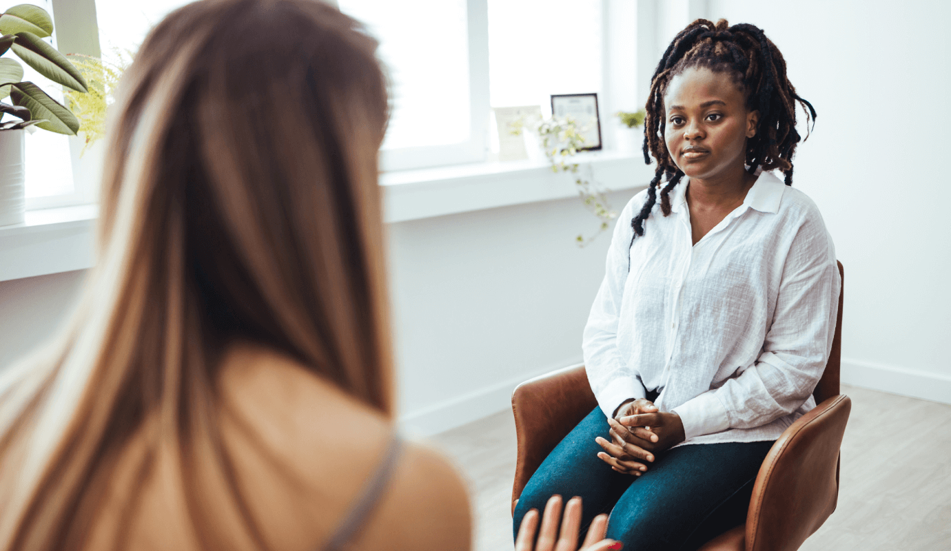 A female therapist meets with her Black client and thinks about how to better serve Black clients