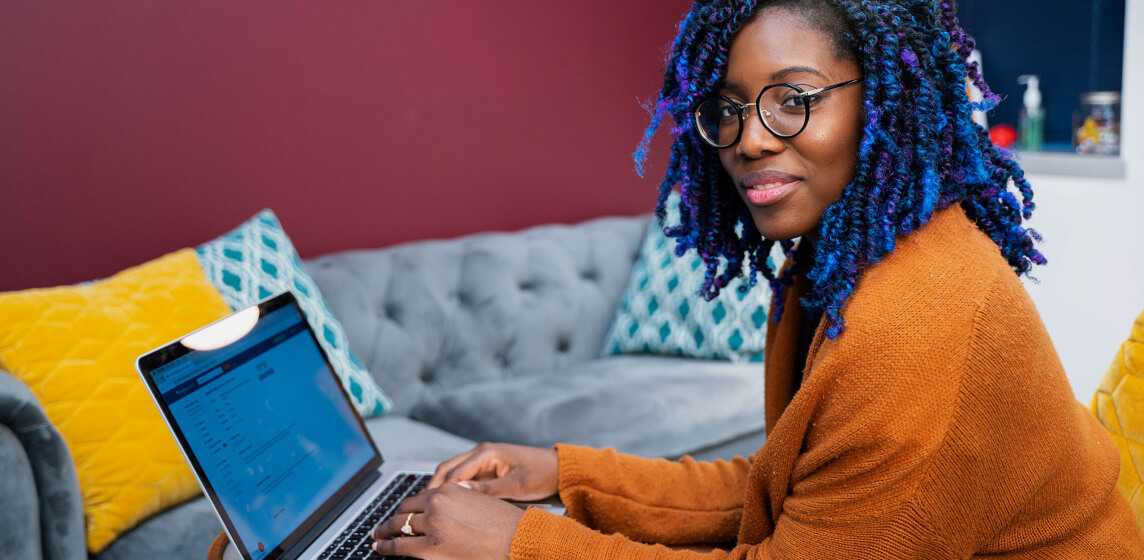 african american woman enjoying flexible online booking software for her practice