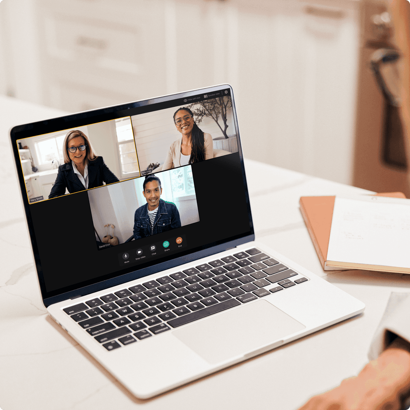 Laptop conducting a group telehealth appointment between an occupational therapist and two clients